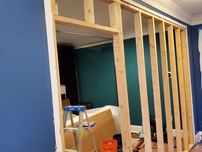 A combination of a display shelf and an opening, allowing you to see through the wall between decor items.